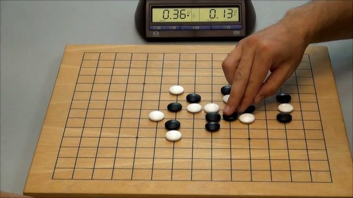 A Gomoku player creating a threat on the board